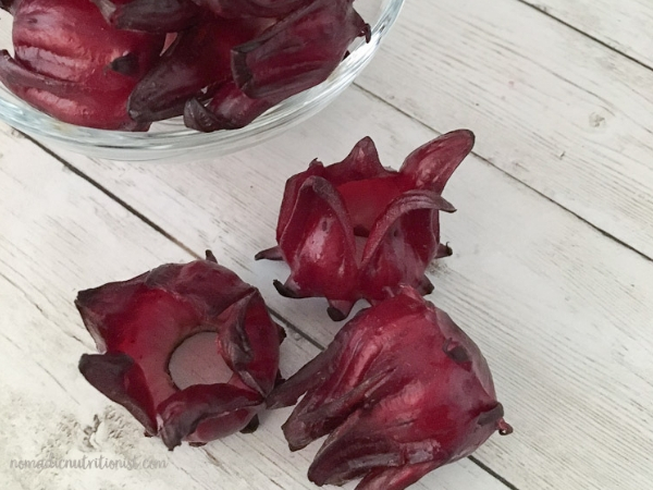 Three whole fresh sorrel on a white background