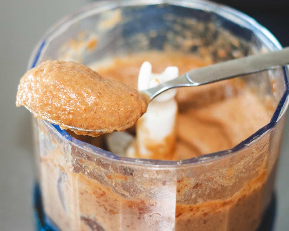 A small food processor jar with date paste.